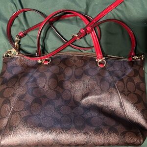 Coach Signature bag, brown with red trim.
